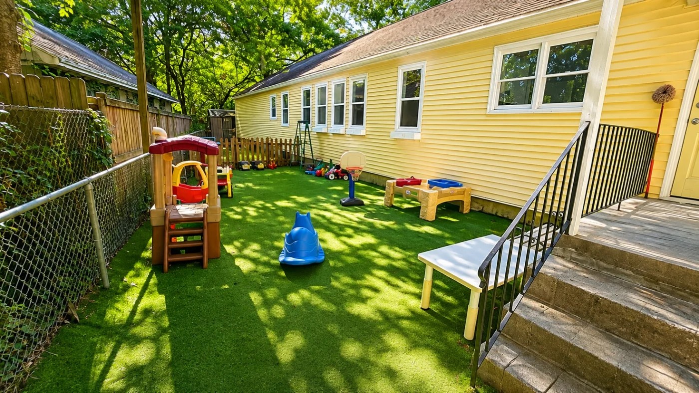 YES outdoor play space beside the yellow school building